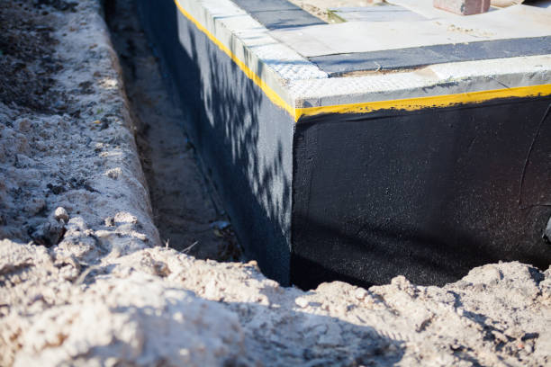 Professional Emergency Waterproofing technician working in Massillon, OH